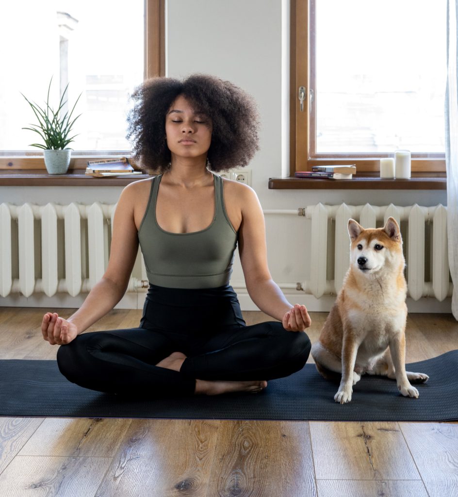 Woman practicing yoga at home. 